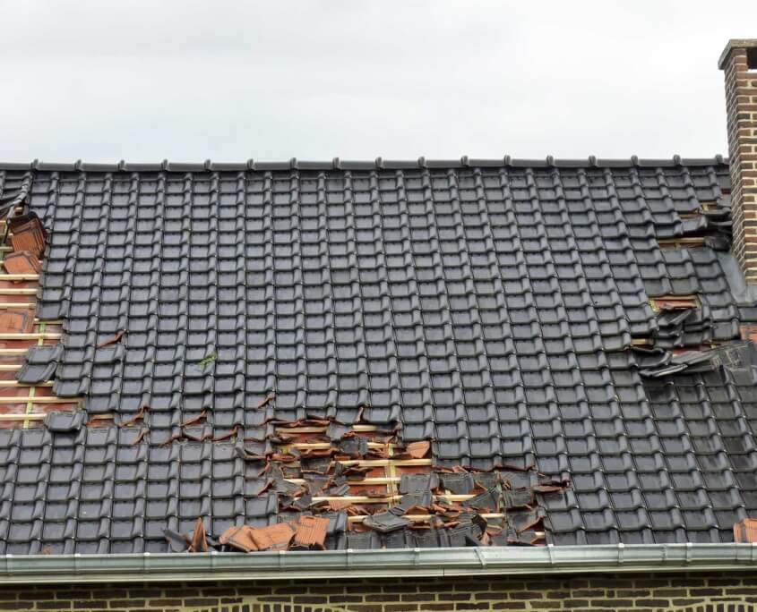 Residential roof with wind damage