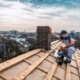 roofer working on top of residential roof
